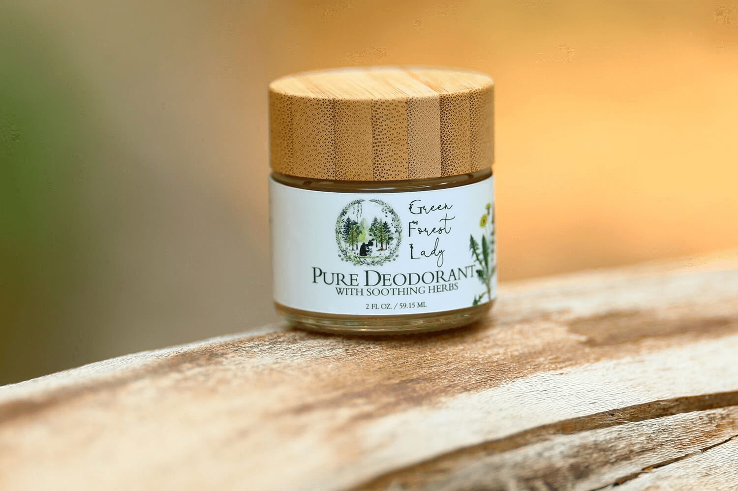 Glass jar sitting of Pure Deodorant on a wood table